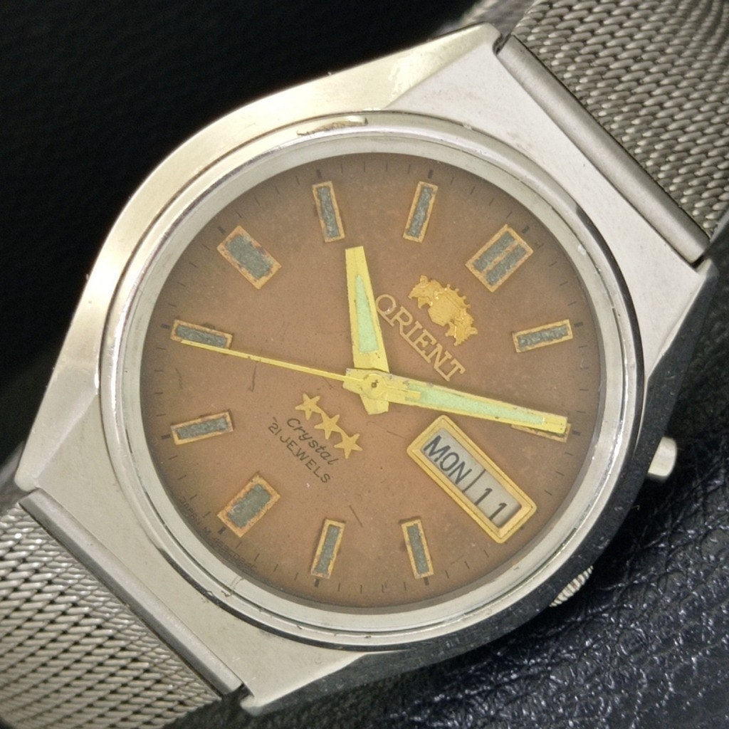 Vintage 1974 Orient Automatic Mens Silver Watch WDaydate  Gold Accents